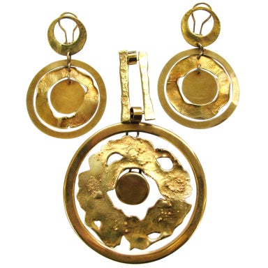 A Modernist Gold Pendant and Ear Clips