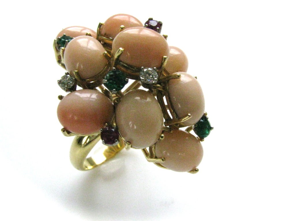 A stylish coral and gemstone cocktail ring. 1 3/4 x 1 1/2