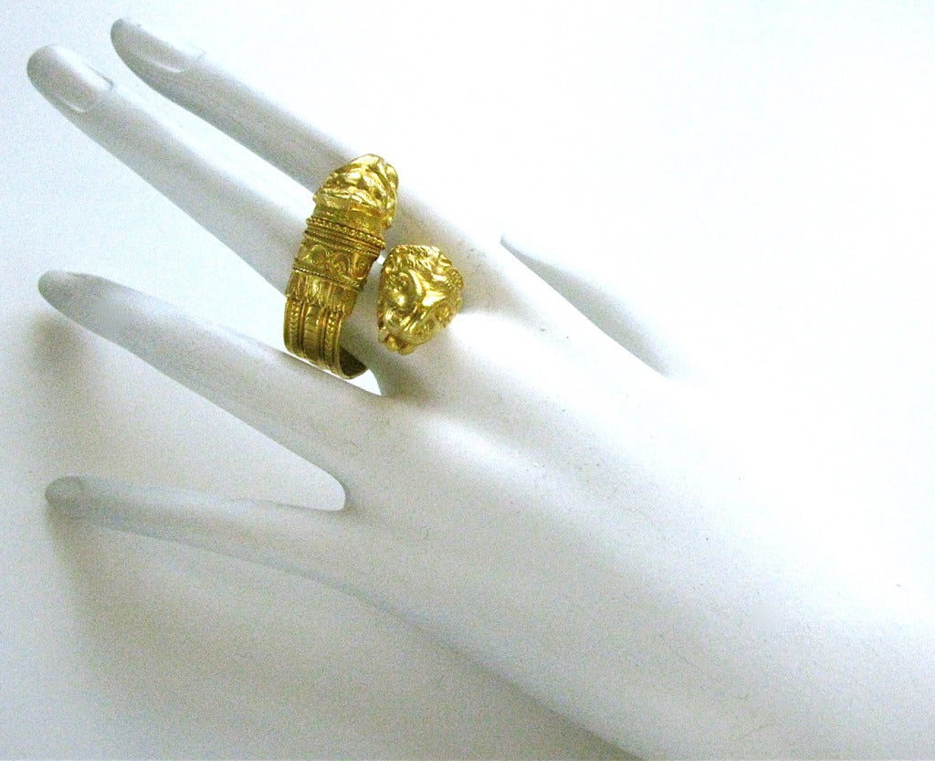 Illias Lalaounis, a bold gold cross-over ring. The 1 1/8