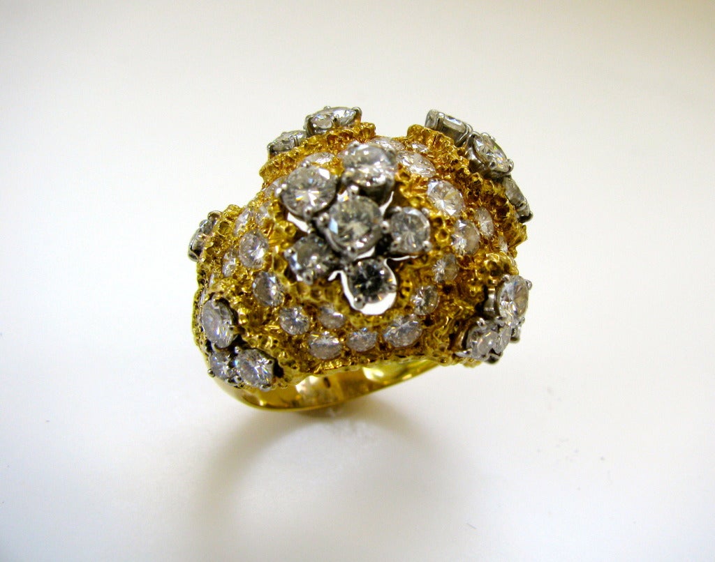 A Stunning Diamond and Gold Dome ring. The 5/8