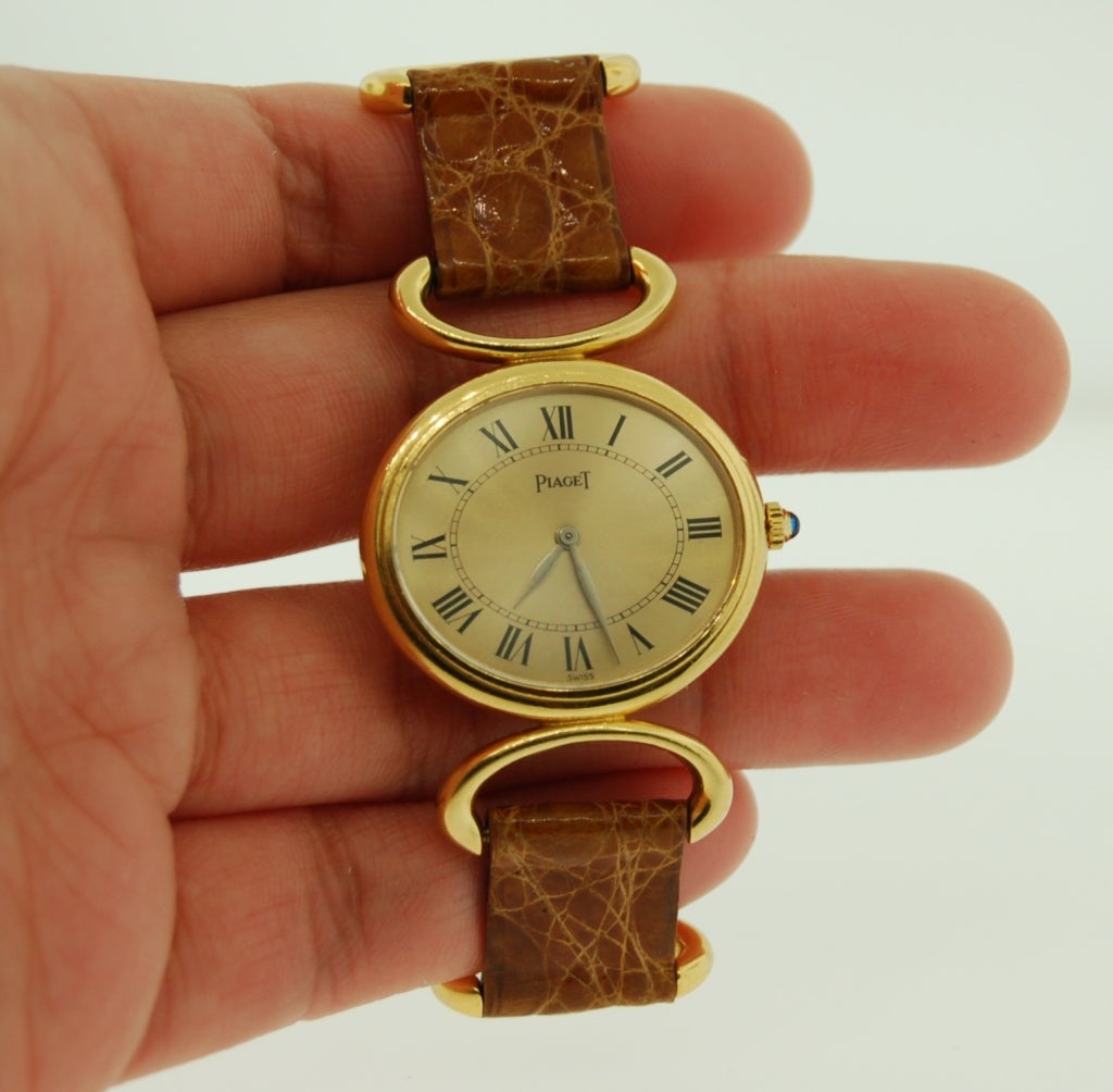 Piaget lady's yellow gold dress watch, circa 1970s

Classic lady's 18k yellow gold watch, 27 mm oval case. Black roman numerals, manual-wind watch, Ref. 9802, Circa 1970s. Case number 296164. 18k Piaget buckle.

Condition: Excellent
Series: