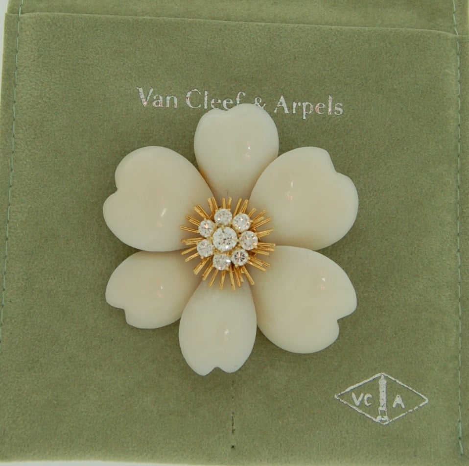 Van Cleef & Arpels 18K Rose De Noel Diamond Brooch

Circa 1960's

Vintage Van Cleef & Arpels Diamond Brooch. Set in 18K yellow gold, comprising a clip brooch designed as a flowerhead to the wireworks pistils and diamond cluster centre. Signed