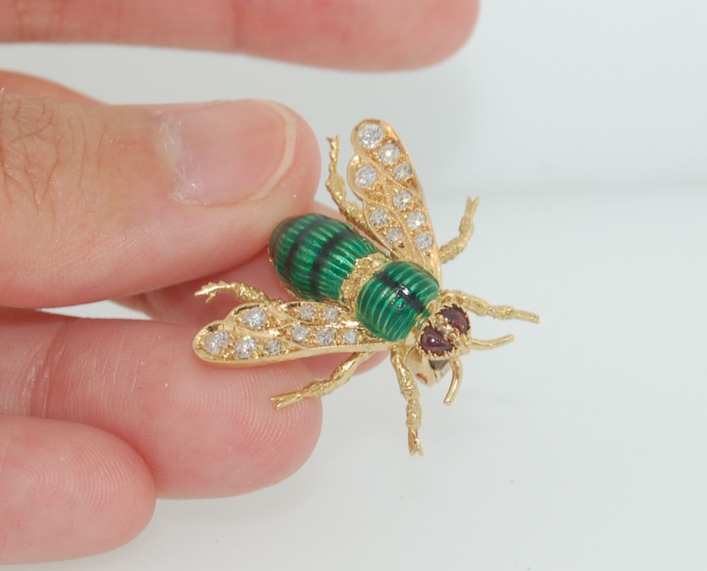 1970's Boucheron Paris 18K Yellow Gold Diamond & Ruby Wasp Brooch<br />
<br />
<br />
Specification: 18K Yellow Gold with .55 TCW Diamond wings, Two Ruby Eyes, and green enameled body. <br />
<br />
Signed: 