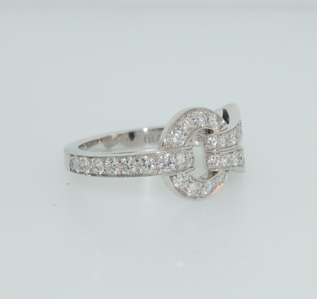Elegant Cartier ring from the Agrafe Collection. 18K white gold ring with with pave set diamonds. Ring Size: 6. Signed 
