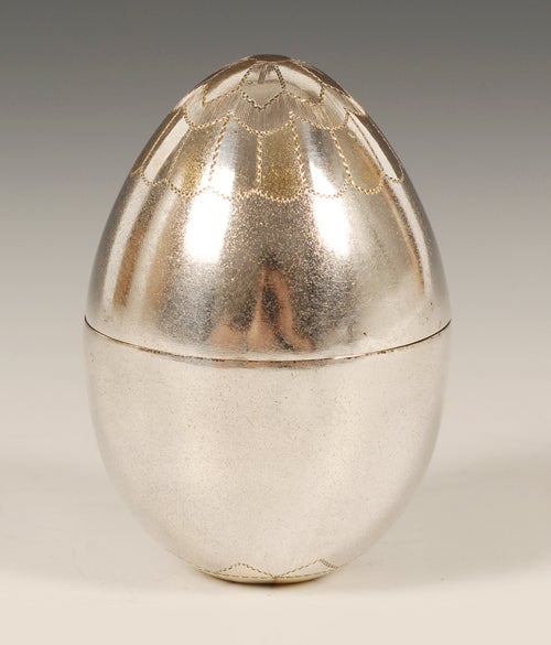 A Russian silver gilded egg, maker’s mark unclear.  The two-part egg with gilded interior, with “XB” engraved on the front side for “Christ has Risen”.  Height: 2 3/8”.