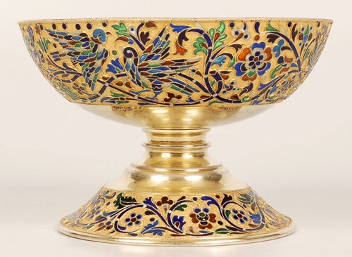 A Russian silver gilt and plique-a-jour enamel footed bowl, no apparent maker’s mark, Moscow, circa 1890. The hemispherical bowl decorated with translucent multi-color enamel branches, birds, flowers and foliage on a gilt stippled ground with