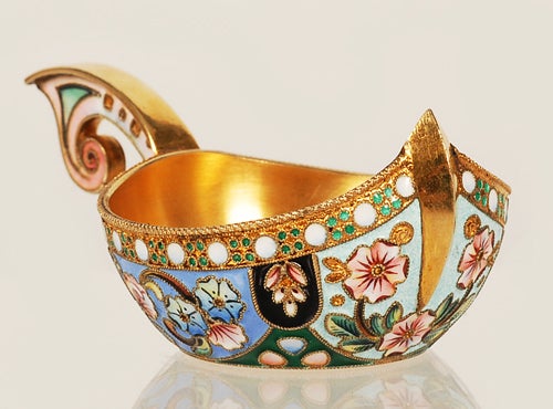 A Russian silver gilt and shaded cloisonné enamel kovsh, 11th Artel, Moscow, 1908-1917. In Art Nouveau taste with a shaped hook handle, the exterior decorated with multi-color shaded stylized daisies and tulips against foliate and geometric motifs