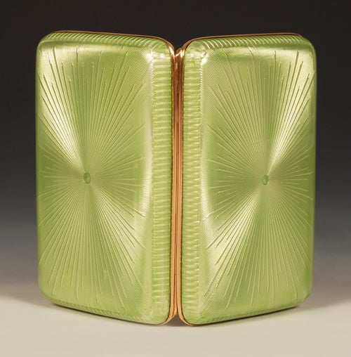 A Fabergé gold-mounted gilded silver and guilloché enamel cigarette case, workmaster Michael Perchin, Saint Petersburg, circa 1899-1903, with later scratched inventory number Z239. Rounded rectangular, enameled in translucent apple green over a