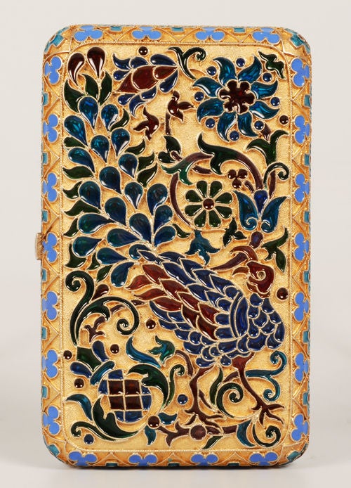 A Russian silver gilt and plique-a-jour enamel cigarette case, apparently unmarked, Moscow, circa 1900. Of rectangular form with rounded corners, both sides of the case decorated in pierced translucent plique-a-jour enamel featuring mythical bird