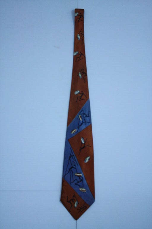 The most covetable of collectable vintage ties. Surrealist dandy Salvador Dali in the 40's had 43 different designs made. They were handpainted on silk, depicting details from his masterpieces. Some are harder to obtain and this is one of the rarer