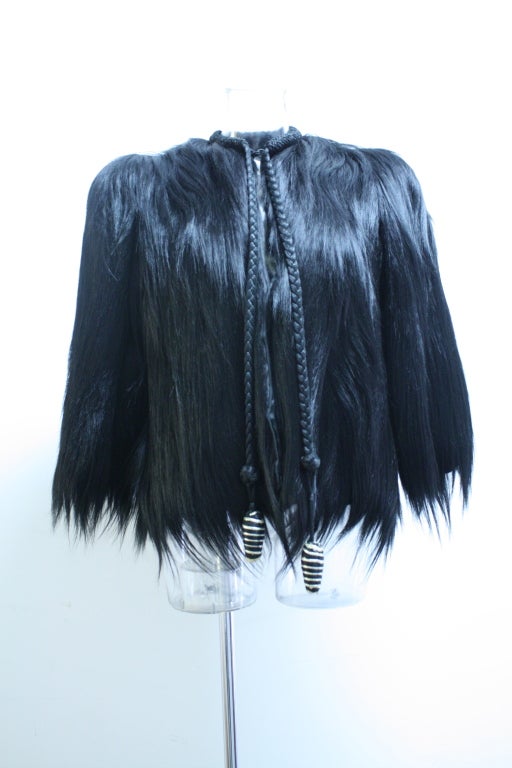 Made from the pelt of the Abyssinian, or Central African Colobus Monkey, the fur is very long (reaching lengths of 5 inches or so), sleek, shiny. It looks and feels eerily like human hair. Monkey fur was very popular from the mid nineteenth century