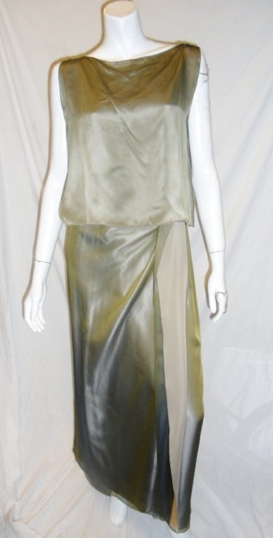 Golden Sleeveless blouse and elastic waist maxi skirt  woth front panel that tucks in as a wrap part. Two layers of silk. one liquid silk   is golden/ taupe and top one is golden iridescent chiffon. Truly beautiful. 
New. One size fits all
Free