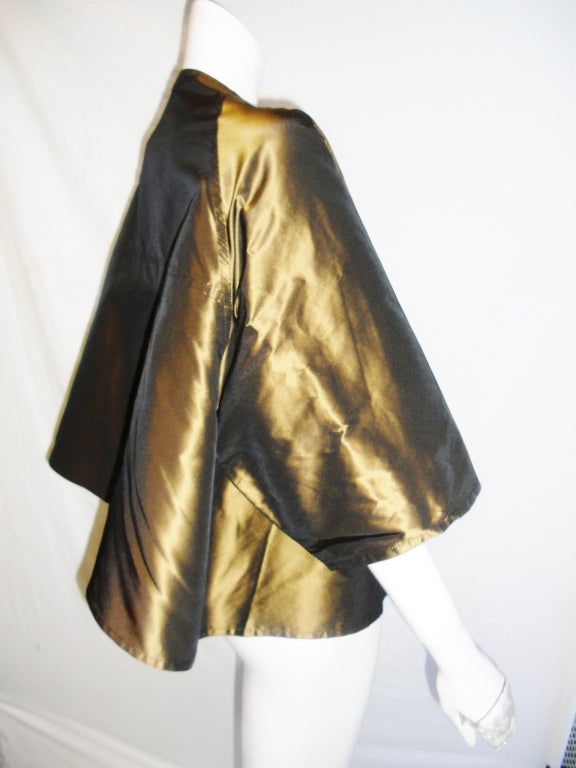 Pretty silk swing silk taffeta jacket. 3/4 sleeves deep folded pleat at the back . Great to ware  casual or as evening piece. 
One size fits all
Free shipping