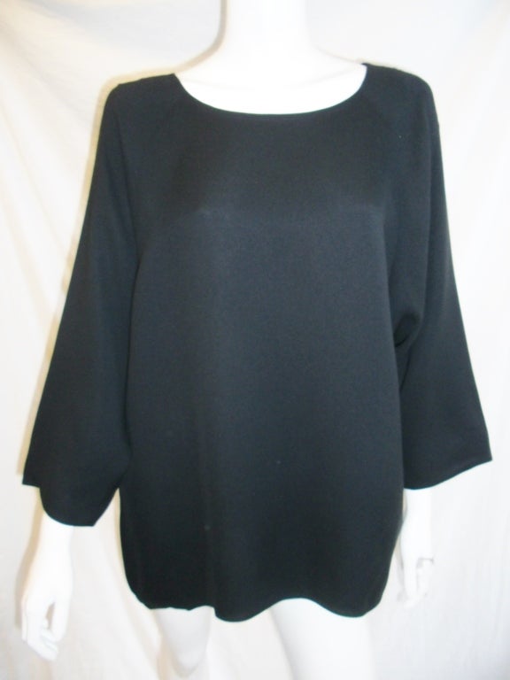 Perfect  top. long sleeves, boat neckline , clean lines. black crepe silk. 
Free shipping