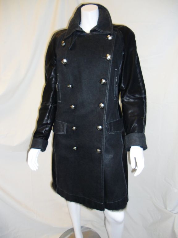 Amazing and beautiful. Baby soft black Lambskin with waterproof treated denim. Double breasted  closure. Large silver toned CD logo buttons with crest. Braided leather details. Fully detachable Rabbit fur lining. Mint condition.