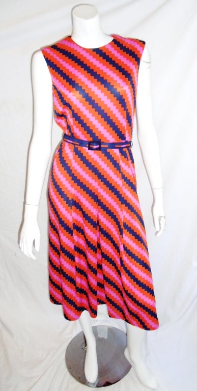 Vibrant colors ziz zag print silky jerseys day dress by Hanae Mori. Circa 1970. zipper back closure. belted. 
Bust 40