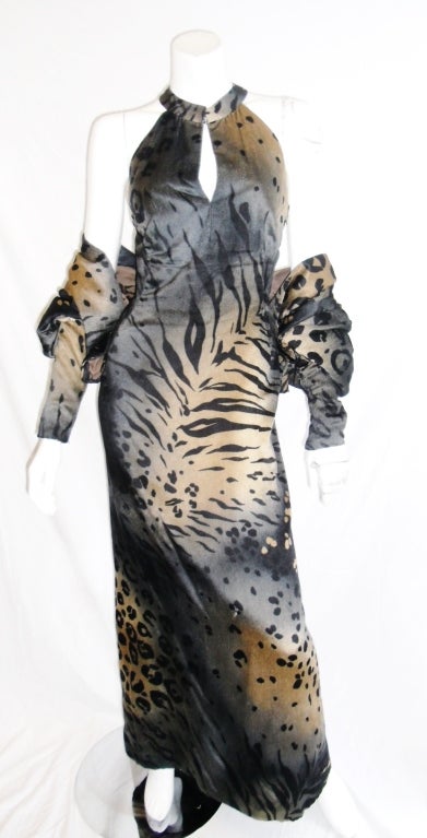 Stunning Pauline Trigere  Animal print Gown and Jacket. Keyhole front with low cut back. Short bolero with  top puffed up sleeves and one top button closure. tight zip bottom fit at the wrists.
Dress bust  36