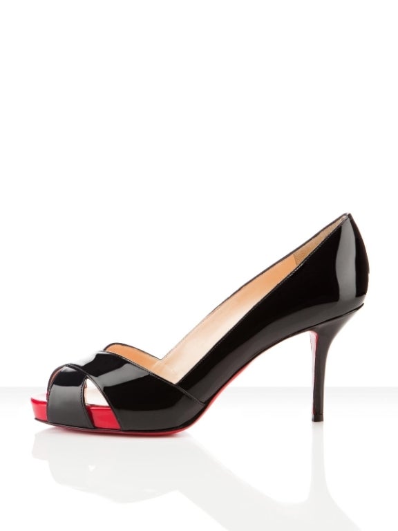 Elegant Christian Louboutin black and red patent leather Shelley shoes. Worn only once but are in MINT condition. 3.5 inch heel.
Shipped in box.