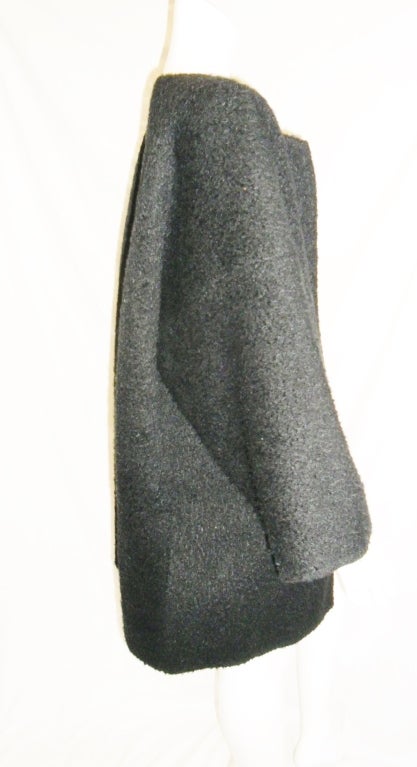 Fabulous New Zoran must have Black Boiled Wool Car coat. Perfect to keep you warm and tres chic to keep you stylish!!!
Soft and cuddly boiled wool. One size fits all.