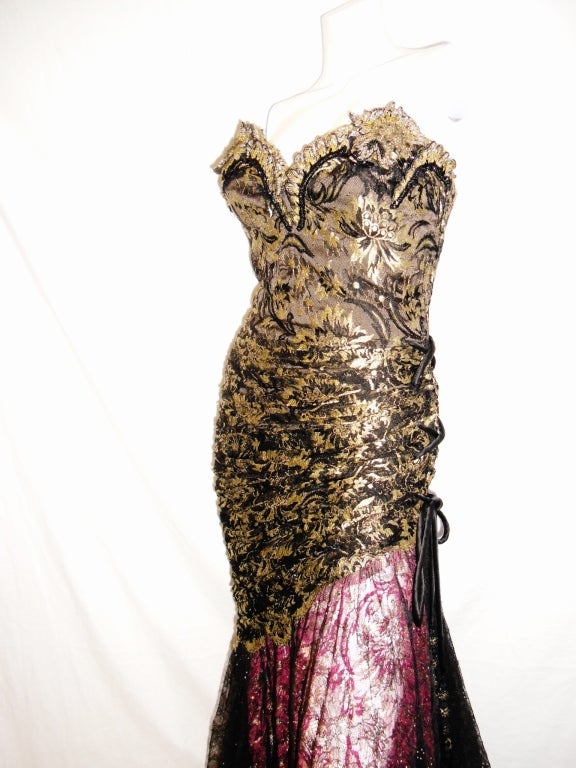 Breathtaking lace  Christian Lacroix  corset gown. Heavily embellished top  with crystals , side tie ending with silk tassels beaded and crystal  encrusted . Rushed bodice. Bottom of the skirt is finished with scalloped lace.Entire dress is