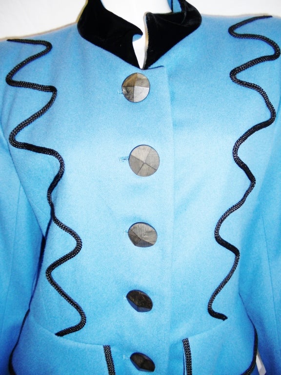 Pristine condition fabulous wool YSL military style jacket with peplum. Black velvet cuffed sleeves and collar. Wood carved buttons. Black lining. Pristine condition. 100% wool. size 38

Shoulders: 17