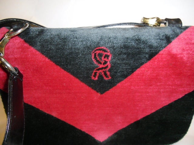 Extremely rare  Roberta di Camerino Velvet and Leather shoulder bag . Hardware is made in shape of a small hands grasping hoops . Plenty of space. 3 separate compartments. Zip top closure with flap over and snap. Black and white color. Logo front.
