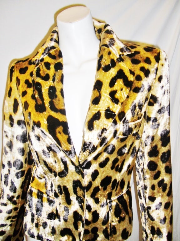 Super chic and always in style  leopard print blazer by Dolce and Gabbana .Two flap front pockets,two front button closure, notched collar and high gloss fabric finish. Great for day or evening. Especially  fabulous with jeans and boots. size 6
