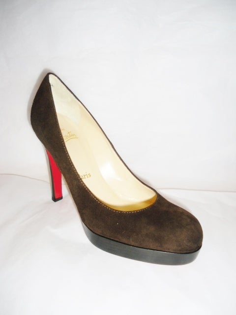 Christian Louboutin Classic Round Toe brown Suede platform pump. Perfect work shoe.  Round toe. Stacked heel and platform.
New Size 37.5
Sorry No Box