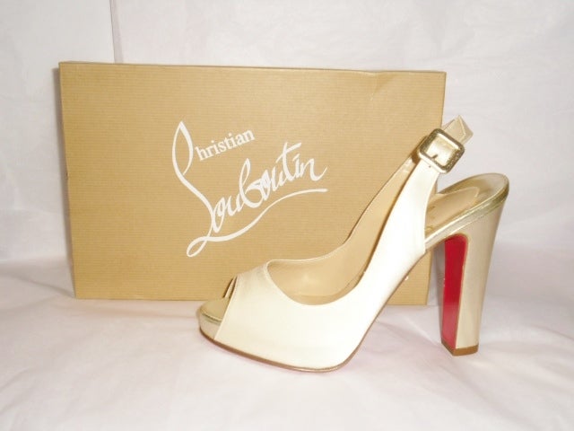 New In box gorgeous and rare Christian Louboutin Gabon Special Occasion / Bridal Ivory silk Sandals . Gold  leather covered heel Gold insole tip and square clasp.
New  Size 37.5 
In  Box