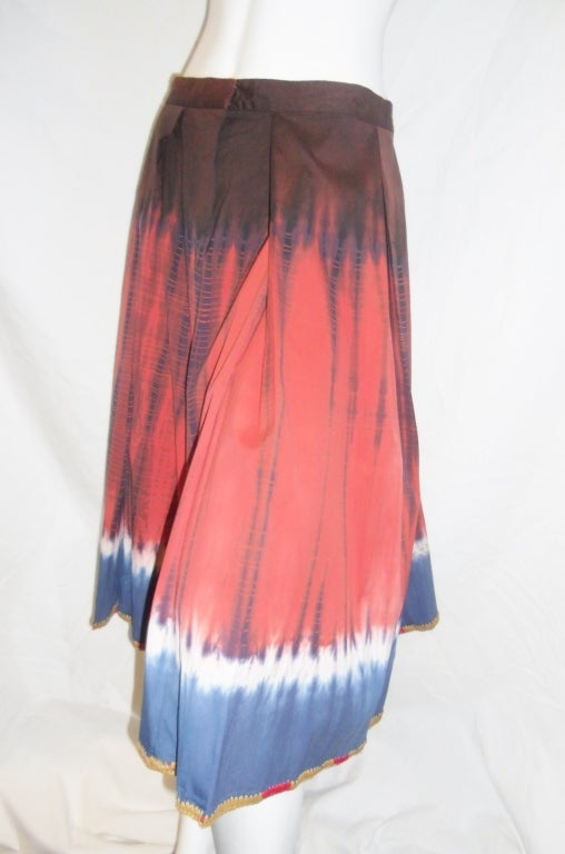 Beautiful never worn Prada Boho style tie-dye  skirt . 100% cotton. Front snap closure.  Hem hand embroidered with straw.  Perfect Summer piece!! 
Size 42. Waist 30