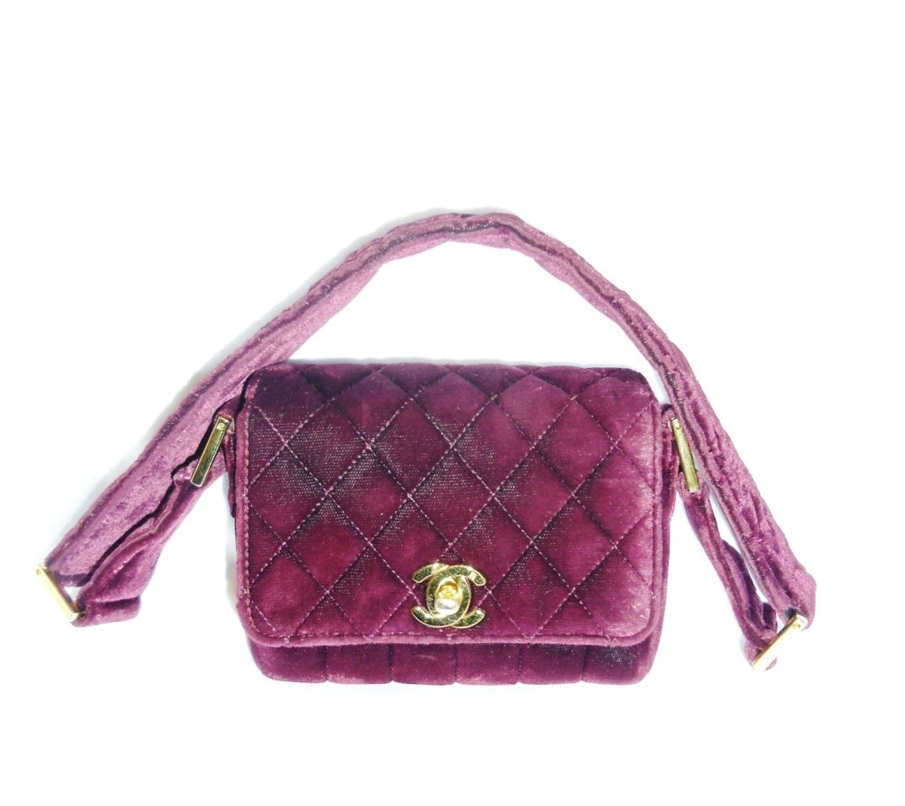 So cute . Collectors item.  Vintage Chanel Burgundy velvet 2.55 quilted evening bag. . very good condition. Gold hardware. wide shoulder-strap. Black leather lining with one inside pocket. 5by 5 by 2 inches. Strap is 1 inch wide and have 10 inches