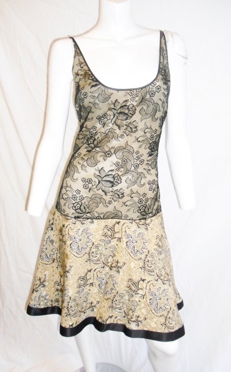 Dress was worn once and it looks absolutely like new. It is breathtaking! Nude silk bodice ovelayed with fine black lace , dropped waistline. Flare skirt part with horse hair underskirt. Top skirt silk is hand painted. . All silk piping trim. and 