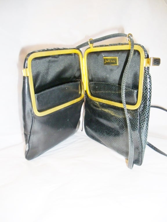 Unusual  and rare Vintage JUDITH LEIBER  Bi Fold  Evening Bag in exotic skin. Navy Color. Side  clip closure that open into fold with pockets. Shoulder strap could be made into double handle or long  single shoulder strap
Excellent condition..