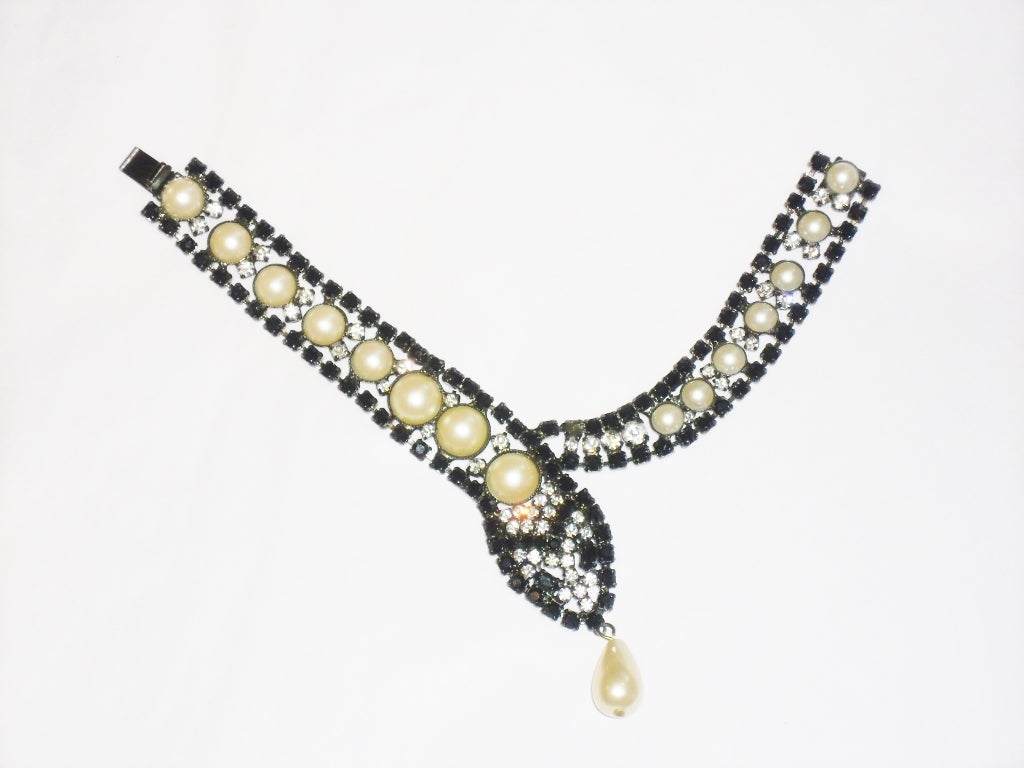 Vintage Butler and Wilson cool bracelet ! Jet Black Crystal Rhinestone's and White Sparkling Crystal Diamante Stones encrusted in / out and around either side of half faux perl  with teardrop shaped Pearl as  Snake tong . Pristine condition.