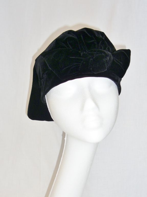 Yves Saint Laurent Vintage velvet Beret Hat With Bow at the front. Unusual design with continuing  piece at the back . Mint condition like new. Label is from the store Field-Schlick.  size 22. True Collectors item