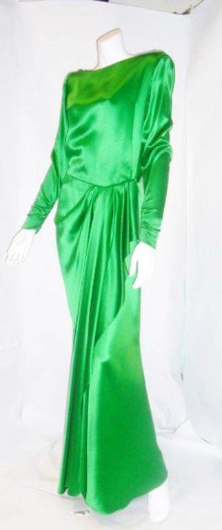 Amazing Signature green silk Vintage Haute Couture  gown by YSL. This True Hollywood glamor  piece of art  is a perfect example of Yves Saint Laurent's timeless tailoring. Draped and cascaded  skirt part  , tightly tailored  sleeves rushed at the