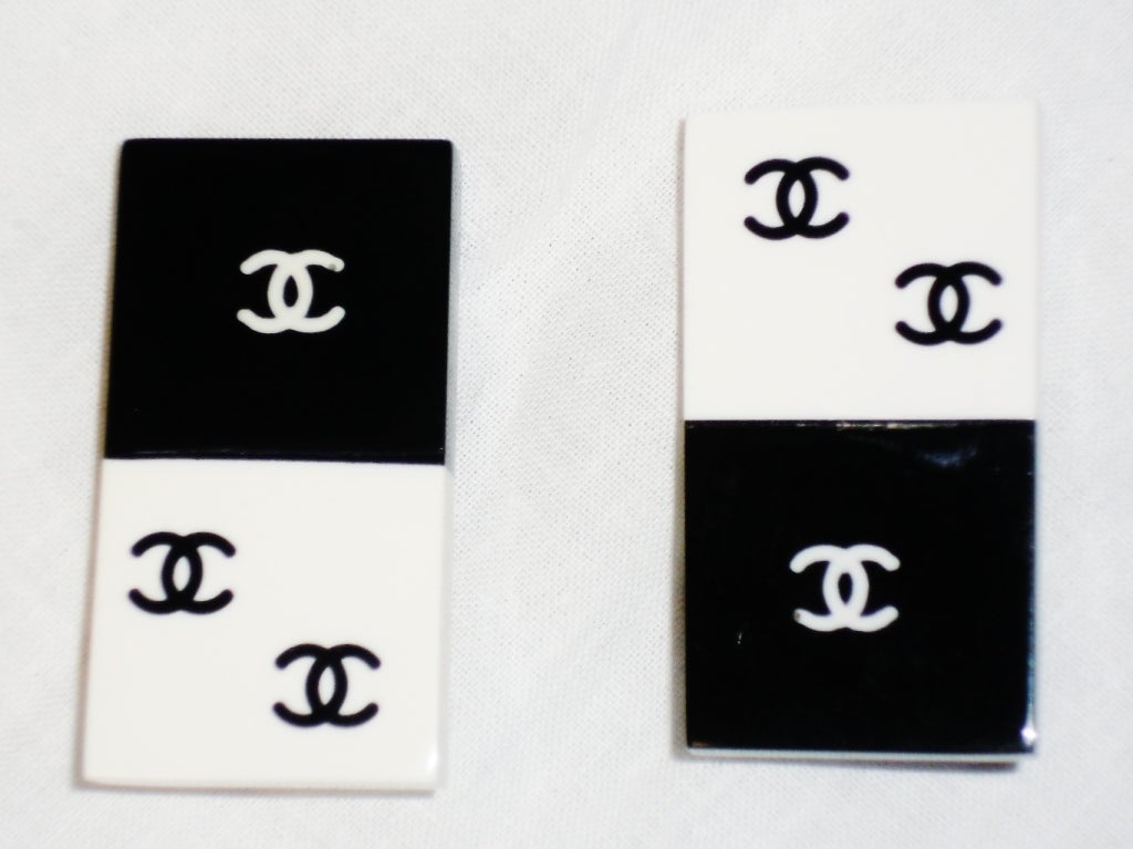Wonderful and highly collectible CHANEL Black & white Lucite clip-on earring in style of domino's.the earrings are signed on the underside and are in excellent condition. Circa 1980s