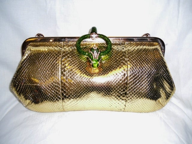 TOM FORD designed for Gucci gold snakeskin handbag. Has green enamel clasp featuring a snakes head. The snake has diamante on it and its mouth is clutching a round cut glass ball. The chain handle is removable, so bag can be used as a clutch bag.