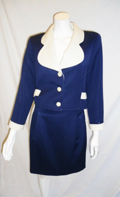 Beautiful high waist skirt and crop style jacket.  Marine style navy with white details and white buttons.  skirt has two pleats at the front.  fully lined.  very light in weight.  Size 36 but it is very small like a US 2.  Jacket measures bust 34