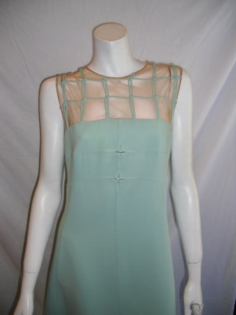 Beautiful lite mint green A line dress by Ralph Rucci. Illusion mesh top with squares details french knots. Signature top stitch down the middle back and front. Concealed back zipper. Silk lined.
bust 38