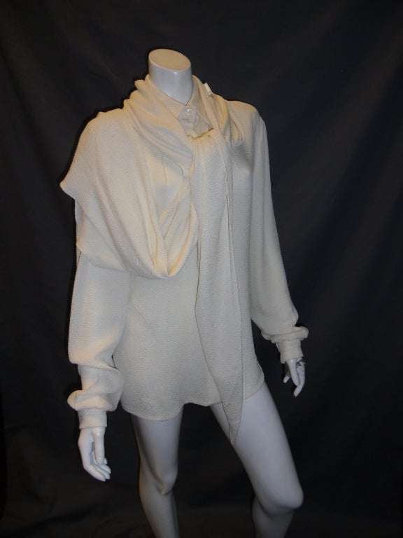 Ivory hammered silk button down blouse Chado Ralph Rucci. Bots Collar. Wide sleeves with cuffs. Accompanied with extra large scarf. Pristine condition , like new. Size 10

Bust 42