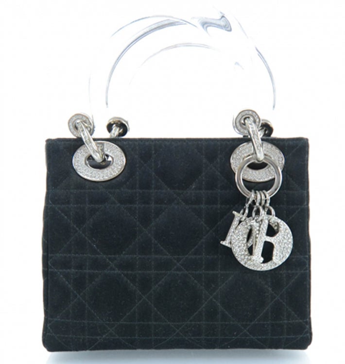 CHRISTIAN DIOR Silk Swarovski Crystal Cannage Evening  Lady Dior in Black. This stylish small tote is crafted of geometric quilted fine black silk. The bag features clear resin top handles with silver hardware including wide eyelets and a Dior name