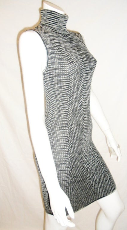 Missoni Vintage Black and White knit Tweed Turtle Neck Dress circa late 1970's absolute Pristine Condition. Very rare to find. Great to be worn under a jacket/Coat. Perfect to any season. Measurements taken flat Italian Size 40.
Bust 28