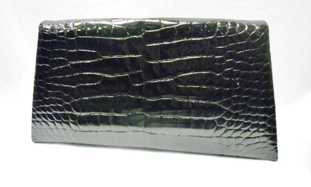 Made for few  personal friends top or the line quality alligator clutch by Cathy Hardwick. Never used. Envelope style. Sterling silver tip marker 925. Leather and suede lined. 
this is the bag that you MUST have in your closet!!

Bag measures:10