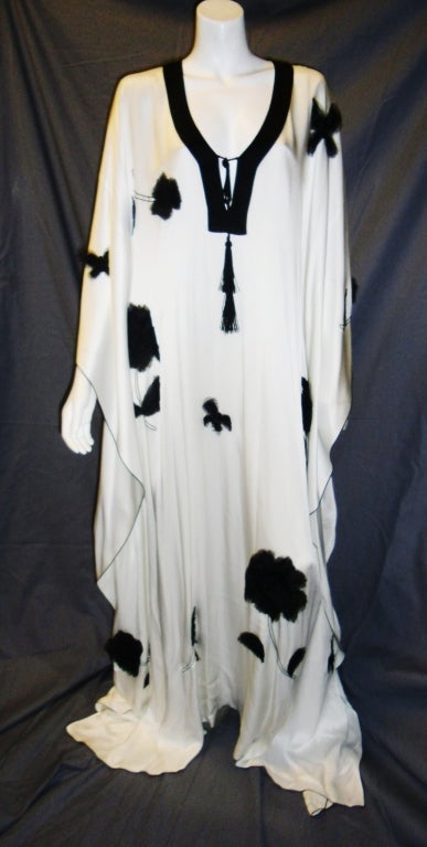 Spectacular Caftan from Paris-based designer Andrew Gn . Embelished with black silk chiffon hand made flowers. New with tags. Retails $2400 Bust 54