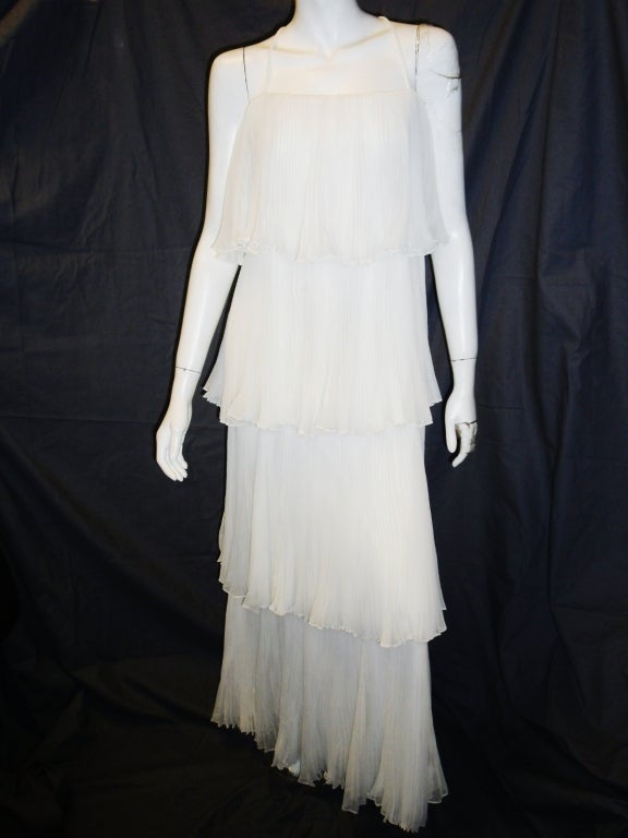 Beautiful snow white Richilene New York From  Elizabeth Arden Salon 4  Tears Pleated gown. Circa  1960's.Absolutely MINT condition like new! Lined with pure white jersey. Dress has back hidden zipper closure.
Bust flat 30