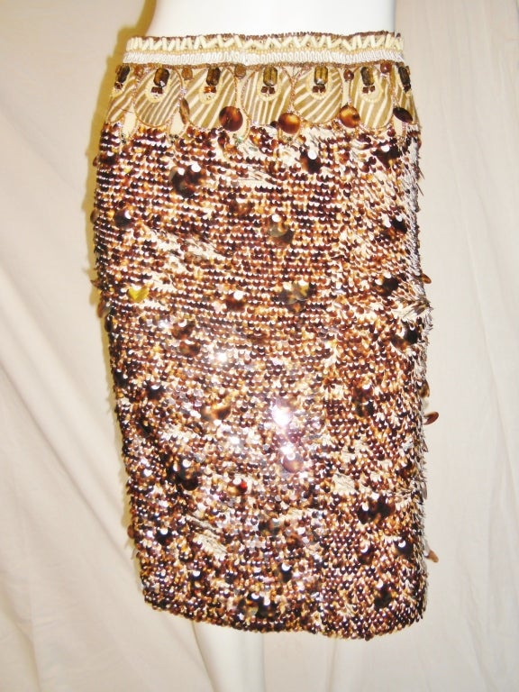 Retailed $2990 this incredible Oscar De La Renta Skirt has so many details that it will take two pages to describe. In short:
Tortoise multi size sequins layer out as fish-scale. Waist line circles in pony hair embroidered and embellished with