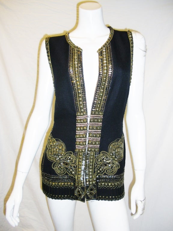 New with Tags highly sought and sold out everywhere Metal Embellished  Vest byDries van Noten . Plunging v-neck. Gold metal embellishments lining front,back,sides,and bottom  Silver, gold,and rose gold colored thread.collection fall 2012
size 42