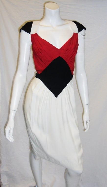 Gaultier red,white,black dress. Spliced color pattern. Black diamond centre. Wide v-neck cut. Sculpored cap sleeves attached adjustable  waist belt Back zipper
size usa 10