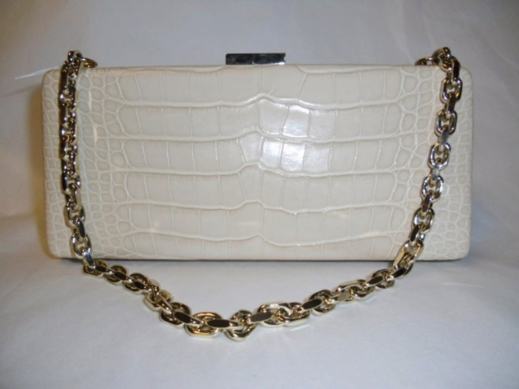 New with tags spectacular  hard side genuine  Crocodile belly Escada evening Bag-Clutch  in beige. Retail $4890 Fines lamb skin lining . gold tone frame and chain  that is storable inside of the bag. . Color is lite
